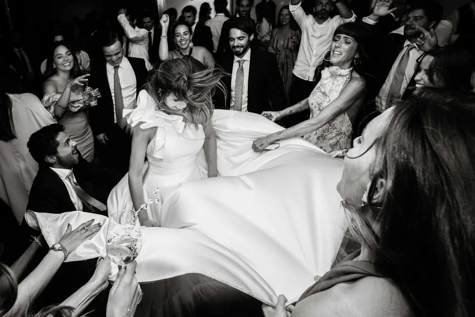 The bride lifted up on the dance floor